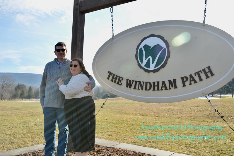 Couple poses beside sign reading The Windham Path.